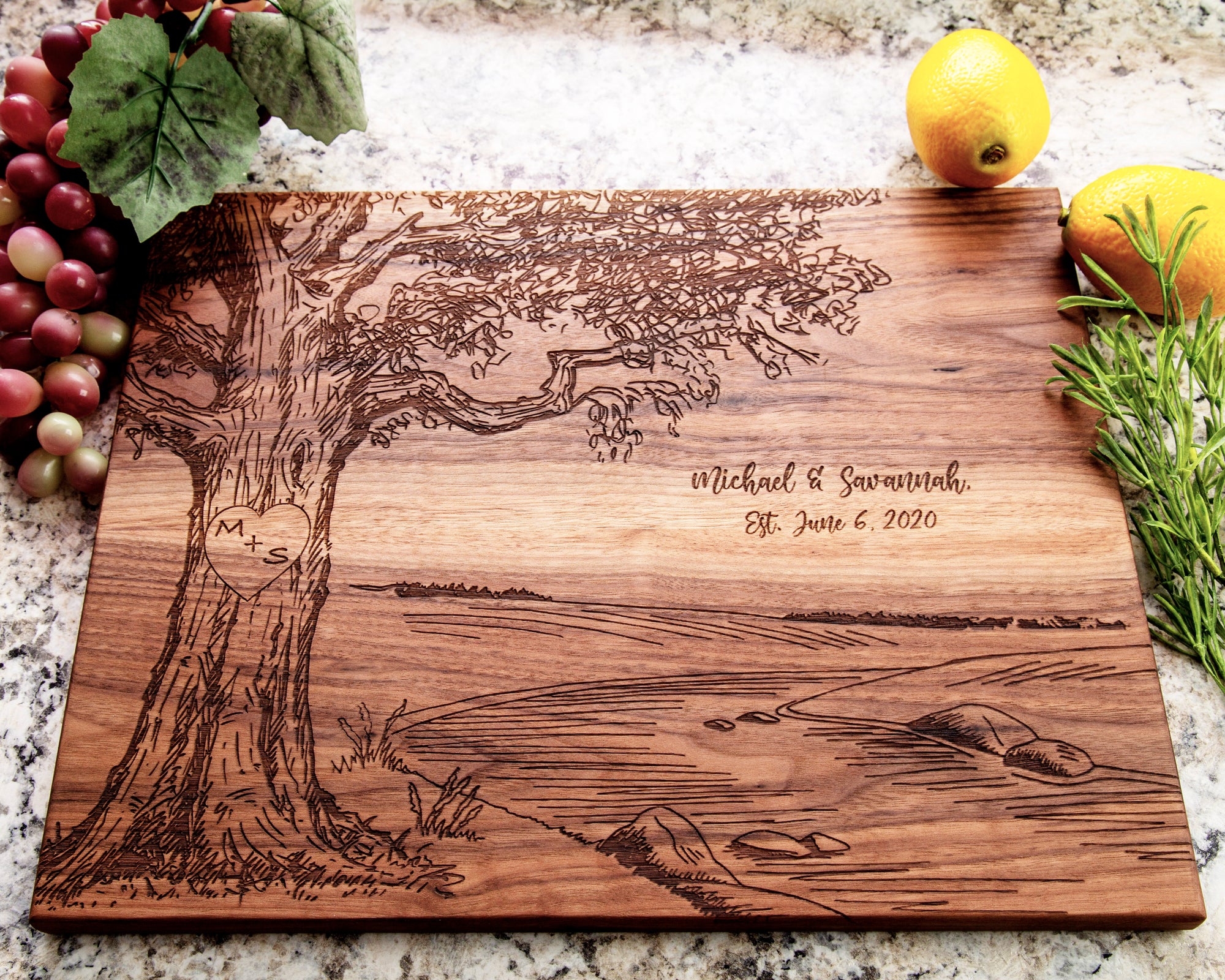 This elegant River Scene Design Cutting Board with Initials Inside a Heart is an ideal wedding or anniversary present. Constructed with superior oak wood, it's sure to be a treasured memory for many years. An unforgettable way to honor any celebration!