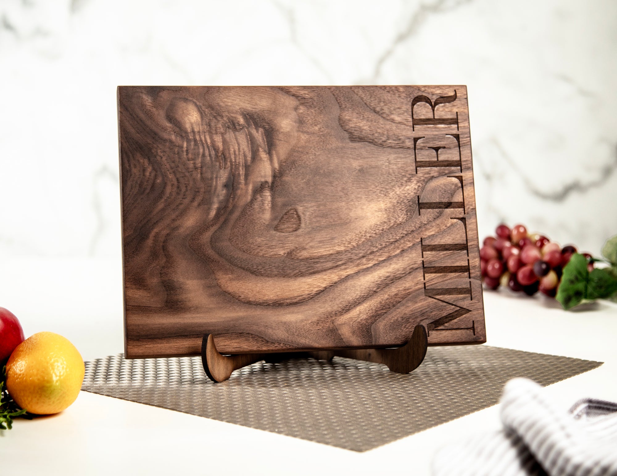 Just got my hands on the Gava Shops walnut cutting board with our bold last name engraved on it! It's not just functional, but also adds a touch of personalization to our kitchen. Love it! 🙌🏼🔪 #KitchenEssentials #PersonalizedTouch