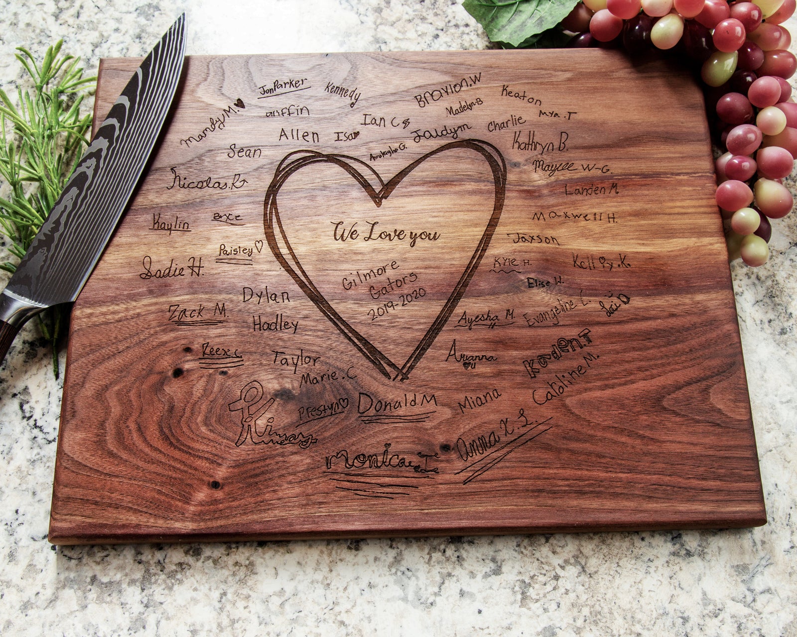 Express gratitude for your child's educator with our original present: a personalized cutting board displaying all of your child's peers' signatures. Our Teacher Gift offers an unparalleled memento that will be cherished for many years!