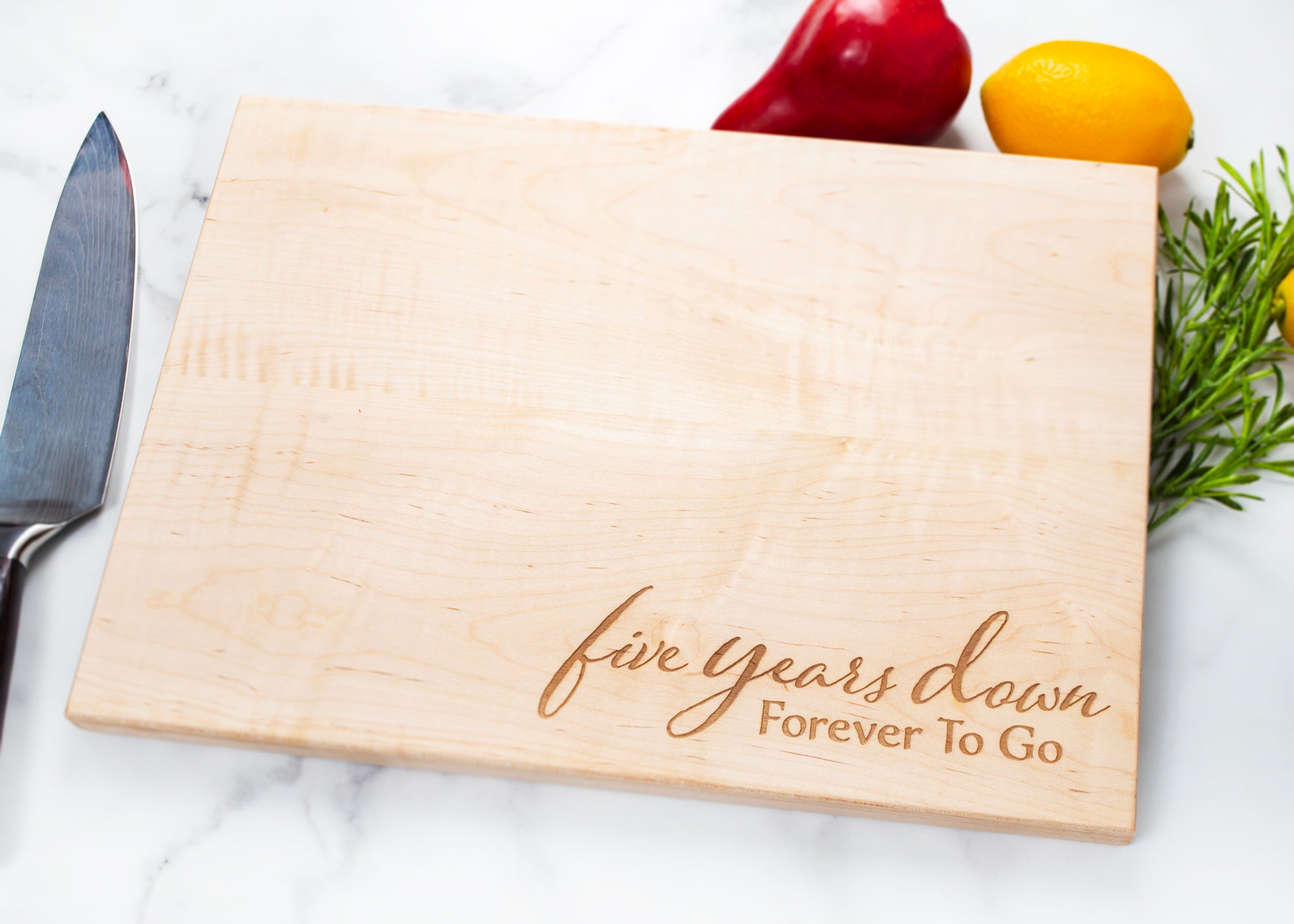 This 5th anniversary personalized cutting board is the perfect wedding, housewarming, or anniversary gift for a couple. Crafted from high-quality wood, the board is sure to last through countless meals and celebrations. It can be personalized with both of their names for an extra special touch. Make their special day even more memorable with this beautiful and meaningful gift