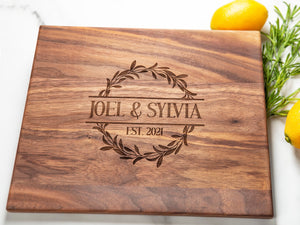 This walnut cutting board features a graceful Floral design, which adds a one-of-a-kind sophistication to any kitchen. An ideal present for special milestones such as anniversaries, weddings, and other joyous events, it will be a long-lasting and cherished part of any couple's home.